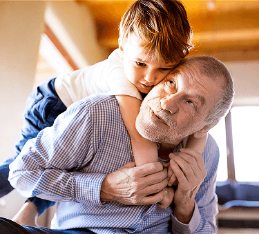 child clinging on to a father figure in a reverse hug