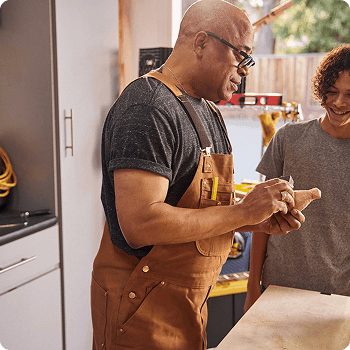 Man working with child in garage