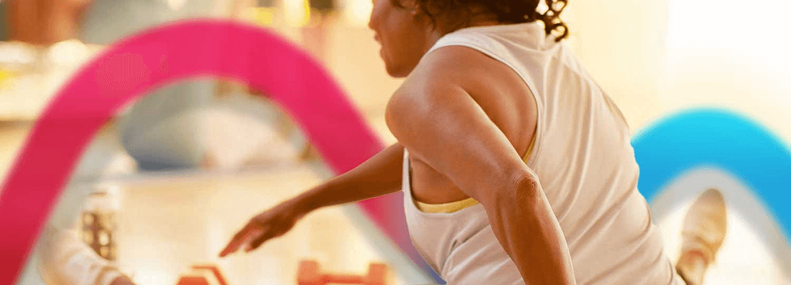 A woman doing light stretches and feeling empowered.