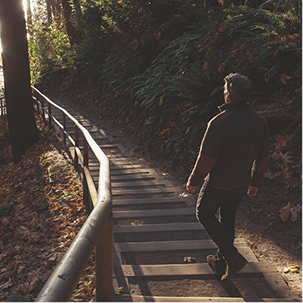Man taking the first steps on a scenic hike