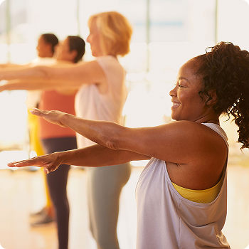 Woman doing stretches at exercise class